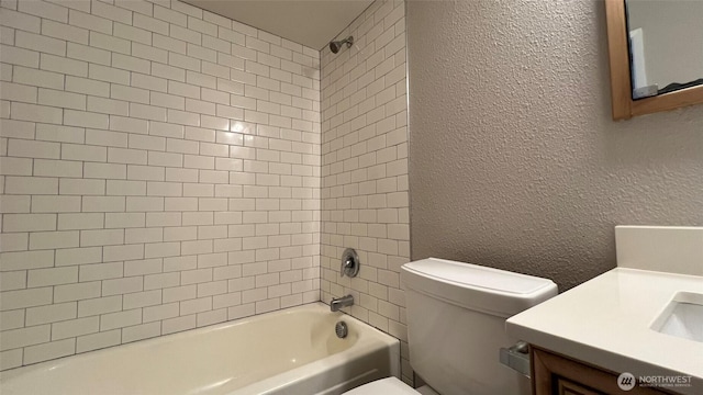 3425 S 176th St Unit 136, Seatac, WA 98188 - bathroom featuring a textured wall, toilet, bathtub / shower combination, and vanity