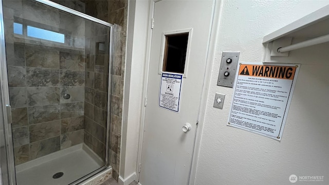 3425 S 176th St Unit 136, Seatac, WA 98188 - bathroom with a stall shower and a textured wall