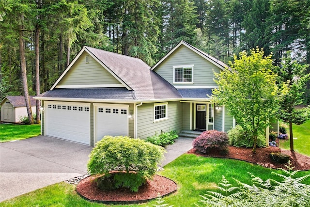 7302 Phillips Rd SE, Port Orchard, WA 98367 - traditional-style house featuring roof with shingles, a garage, a front lawn, and driveway