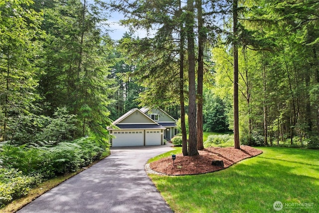 7302 Phillips Rd SE, Port Orchard, WA 98367 - view of front of property featuring driveway, a front yard, a garage, and a view of trees