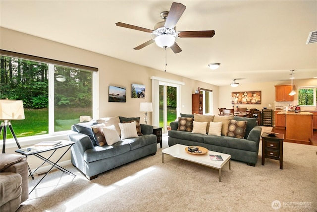 7302 Phillips Rd SE, Port Orchard, WA 98367 - living area featuring light colored carpet and a ceiling fan