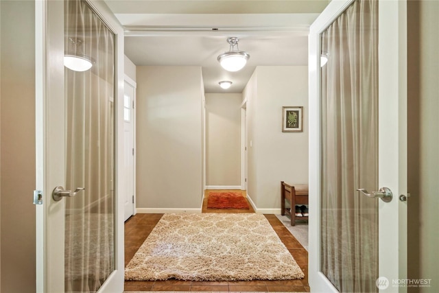 7302 Phillips Rd SE, Port Orchard, WA 98367 - corridor with dark tile patterned floors and baseboards