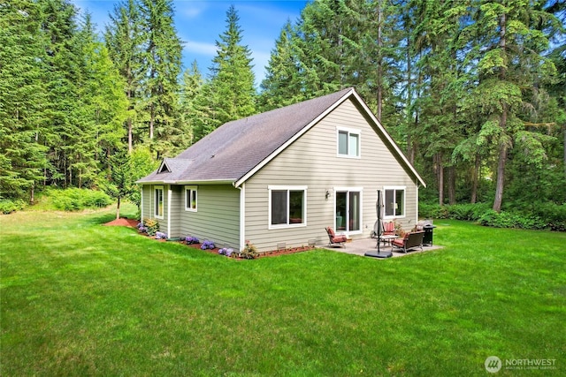 7302 Phillips Rd SE, Port Orchard, WA 98367 - back of property with a patio area, a lawn, and a shingled roof