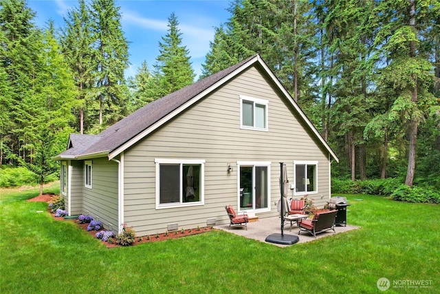7302 Phillips Rd SE, Port Orchard, WA 98367 - rear view of house featuring a shingled roof, a lawn, and a patio