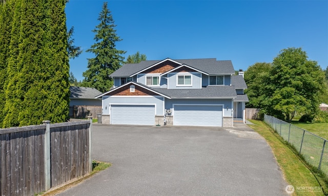 2715 99th Ave NE, Lake Stevens, WA 98258 - view of front facade with driveway and a shingled roof
