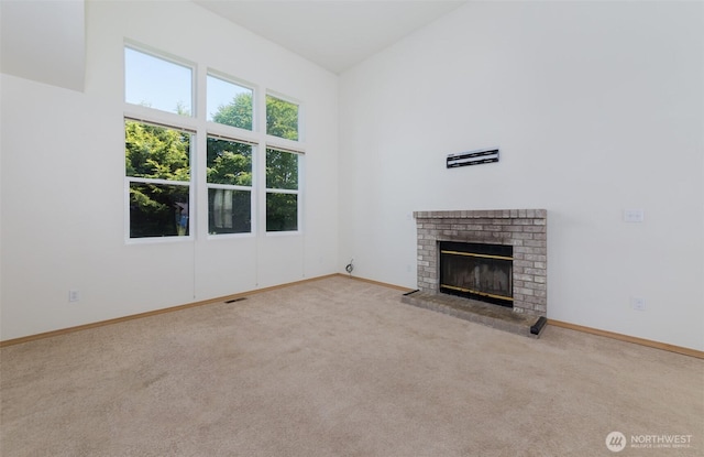 2715 99th Ave NE, Lake Stevens, WA 98258 - unfurnished living room with carpet flooring and a brick fireplace
