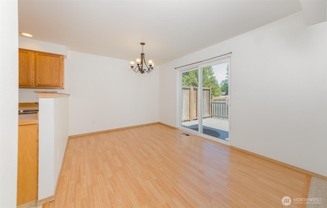 2715 99th Ave NE, Lake Stevens, WA 98258 - unfurnished dining area featuring a chandelier, light wood-style floors, and recessed lighting