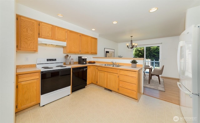 2715 99th Ave NE, Lake Stevens, WA 98258 - kitchen with white appliances, under cabinet range hood, a peninsula, a chandelier, and light flooring