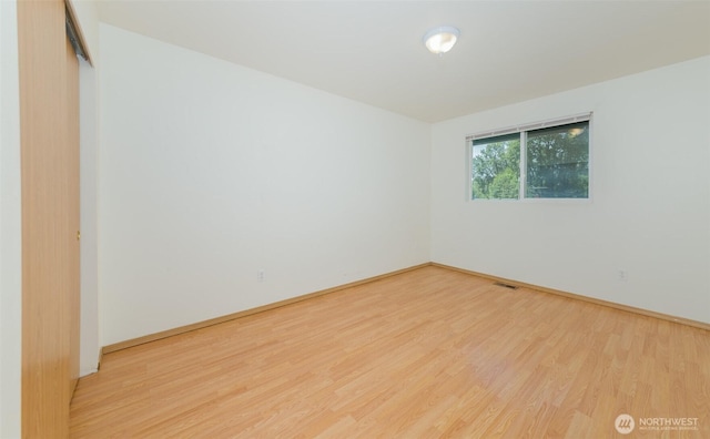 2715 99th Ave NE, Lake Stevens, WA 98258 - spare room featuring wood finished floors and baseboards