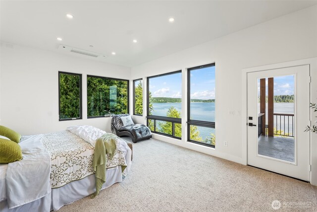 9418 165th Avenue Ct SW, Longbranch, WA 98351 - bedroom with multiple windows, recessed lighting, carpet flooring, and a water view