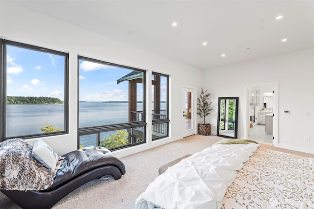 9418 165th Avenue Ct SW, Longbranch, WA 98351 - bedroom featuring light carpet, recessed lighting, a water view, access to exterior, and ensuite bath