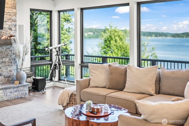 9418 165th Avenue Ct SW, Longbranch, WA 98351 - sunroom with plenty of natural light, wood finished floors, and a water view