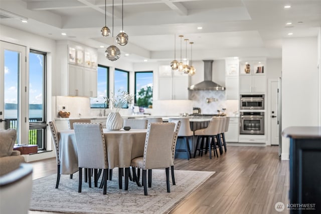 9418 165th Avenue Ct SW, Longbranch, WA 98351 - dining room featuring dark wood finished floors, recessed lighting, coffered ceiling, and beam ceiling