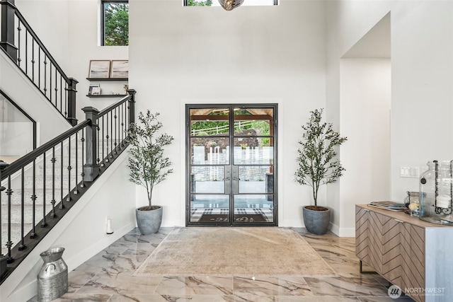 9418 165th Avenue Ct SW, Longbranch, WA 98351 - foyer with a towering ceiling, plenty of natural light, marble finish floors, and stairs