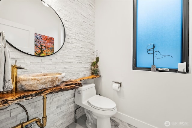 9418 165th Avenue Ct SW, Longbranch, WA 98351 - half bathroom with toilet and marble look tiles