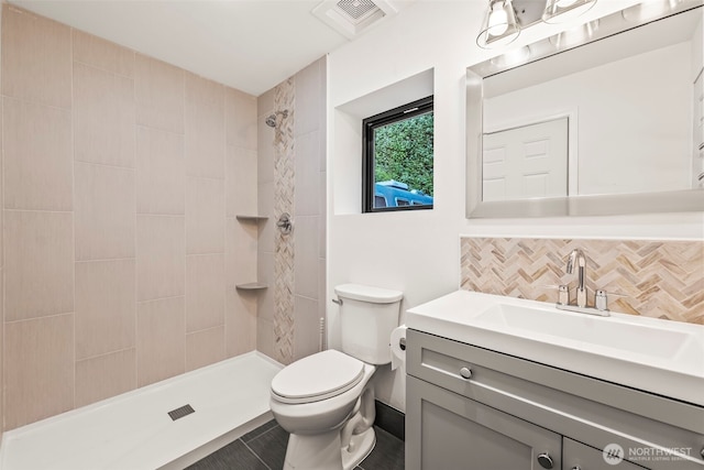 9418 165th Avenue Ct SW, Longbranch, WA 98351 - full bath with a tile shower, vanity, and tasteful backsplash