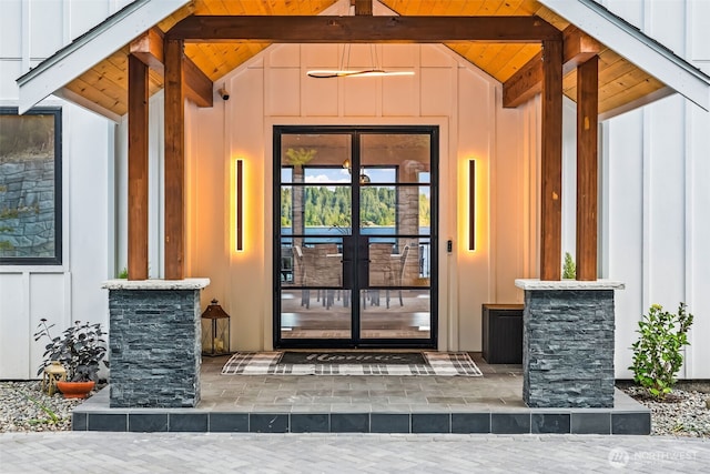 9418 165th Avenue Ct SW, Longbranch, WA 98351 - doorway to property featuring board and batten siding and french doors