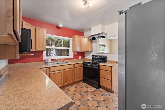 1618 Walla Walla Ave, Walla Walla, WA 99362 - kitchen with black electric range, freestanding refrigerator, a sink, light countertops, and exhaust hood