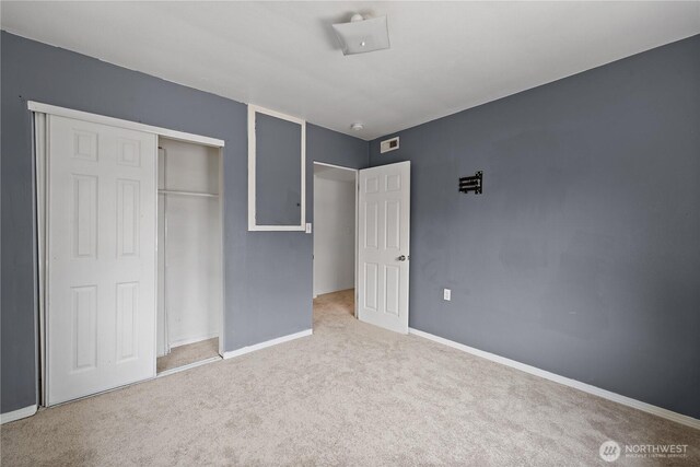 1618 Walla Walla Ave, Walla Walla, WA 99362 - unfurnished bedroom featuring carpet flooring, baseboards, and a closet