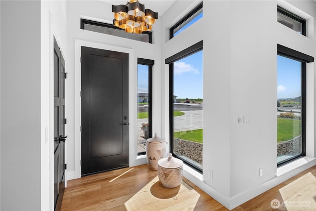 204 Moon River Vw SW, Mattawa, WA 99349 - foyer featuring a chandelier, light wood-style flooring, and baseboards