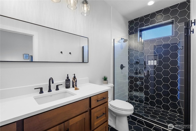 204 Moon River Vw SW, Mattawa, WA 99349 - bathroom featuring vanity, toilet, tiled shower, tile patterned floors, and recessed lighting