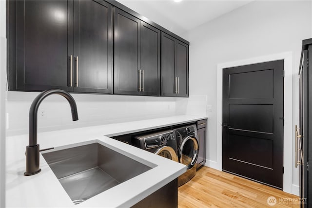 204 Moon River Vw SW, Mattawa, WA 99349 - laundry room with separate washer and dryer, cabinet space, and light wood finished floors