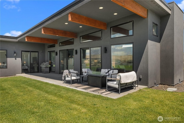 204 Moon River Vw SW, Mattawa, WA 99349 - rear view of house with outdoor lounge area, stucco siding, a patio area, and a lawn