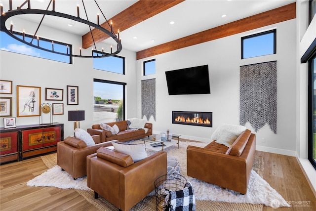 204 Moon River Vw SW, Mattawa, WA 99349 - living area with a high ceiling, recessed lighting, a glass covered fireplace, healthy amount of natural light, and wood finished floors