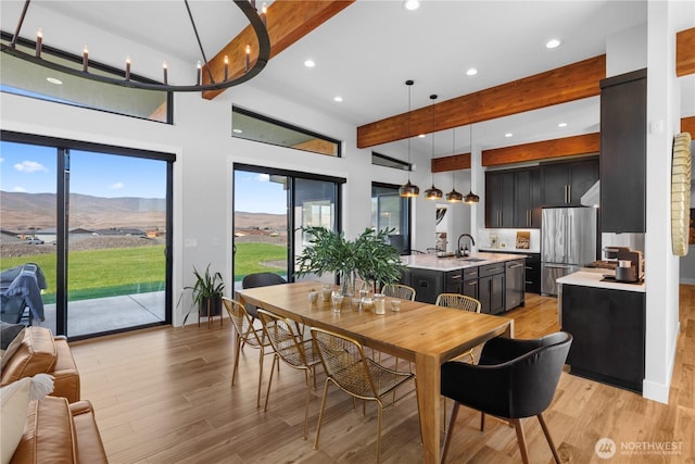 204 Moon River Vw SW, Mattawa, WA 99349 - dining area featuring beamed ceiling, light wood finished floors, recessed lighting, and a mountain view