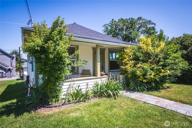 1612 7th St, Anacortes, WA 98221 - view of front of home featuring covered porch, a front yard, and roof with shingles