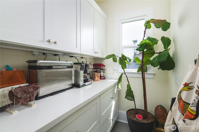 1612 7th St, Anacortes, WA 98221 - kitchen featuring white cabinets and light countertops