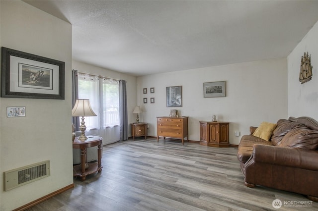 401 Draconis Ave SE, Ocean Shores, WA 98569 - living area featuring light wood-style flooring and baseboards