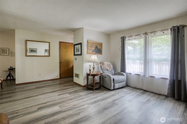 401 Draconis Ave SE, Ocean Shores, WA 98569 - sitting room with wood finished floors and baseboards