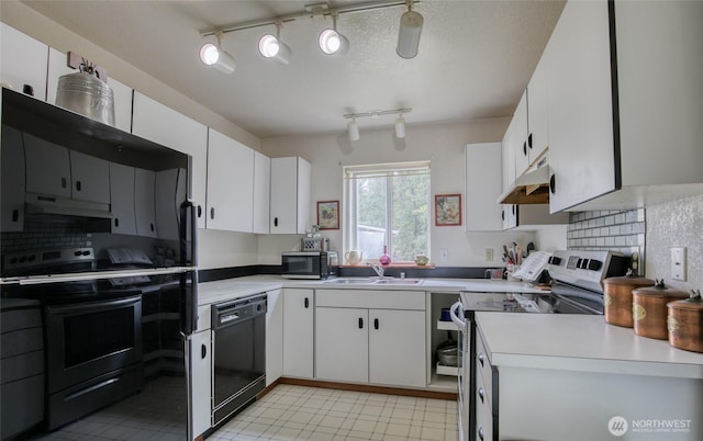 401 Draconis Ave SE, Ocean Shores, WA 98569 - kitchen featuring stainless steel appliances, under cabinet range hood, a sink, and light countertops