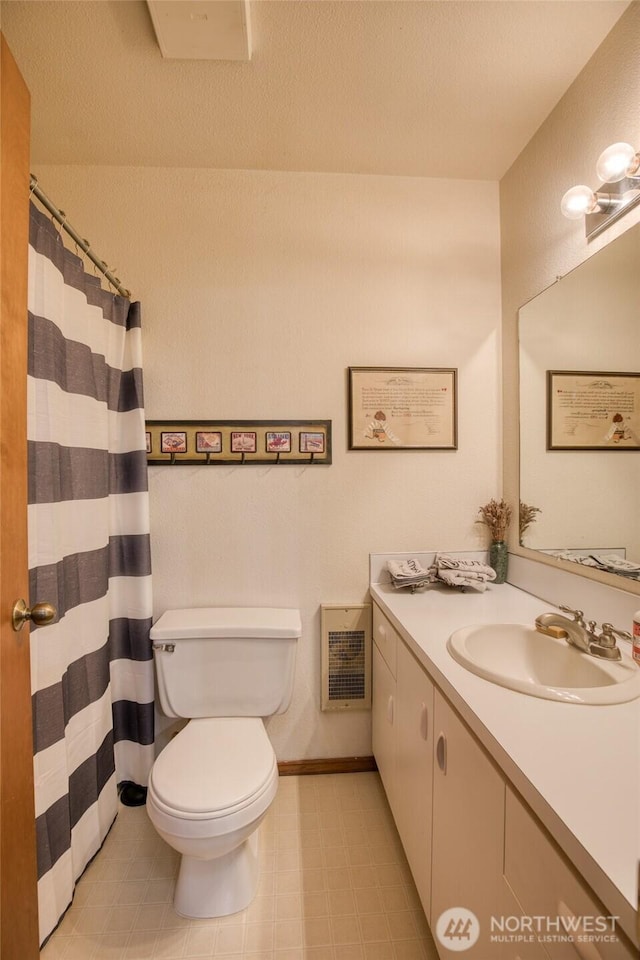 401 Draconis Ave SE, Ocean Shores, WA 98569 - full bath with vanity, toilet, heating unit, and a shower with shower curtain
