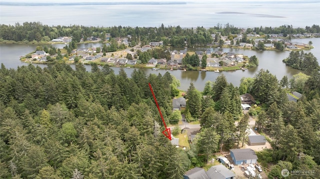 401 Draconis Ave SE, Ocean Shores, WA 98569 - aerial view of property and surrounding area with a large body of water and nearby suburban area
