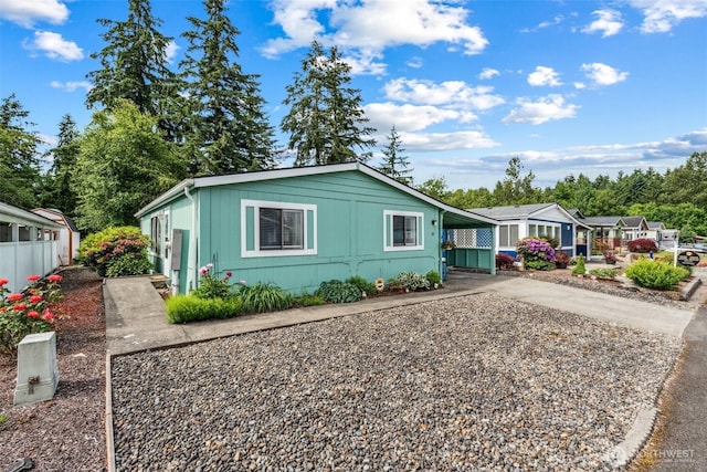 1101 S Scheuber Rd Unit 28, Centralia, WA 98531 - view of front of house with concrete driveway and an attached carport