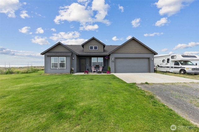 7186 16th Rd NE, Moses Lake, WA 98837 - view of front of house featuring driveway, a garage, and a front yard