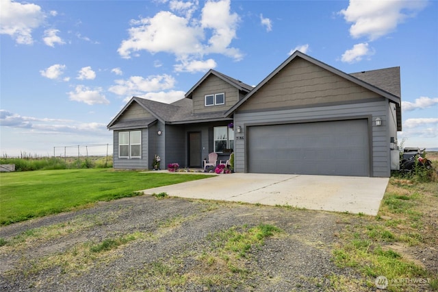 7186 16th Rd NE, Moses Lake, WA 98837 - view of front of property featuring driveway, a front yard, an attached garage, and a shingled roof