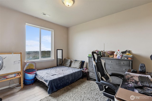7186 16th Rd NE, Moses Lake, WA 98837 - bedroom with wood finished floors and a desk