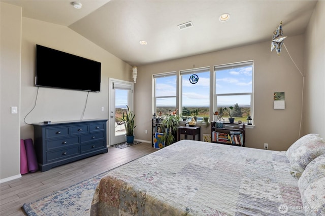 7186 16th Rd NE, Moses Lake, WA 98837 - bedroom featuring light wood finished floors, lofted ceiling, baseboards, access to exterior, and recessed lighting