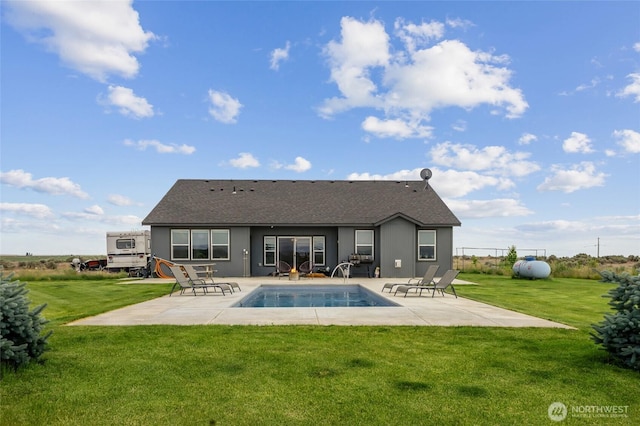 7186 16th Rd NE, Moses Lake, WA 98837 - rear view of house with a patio area, a yard, and a shingled roof