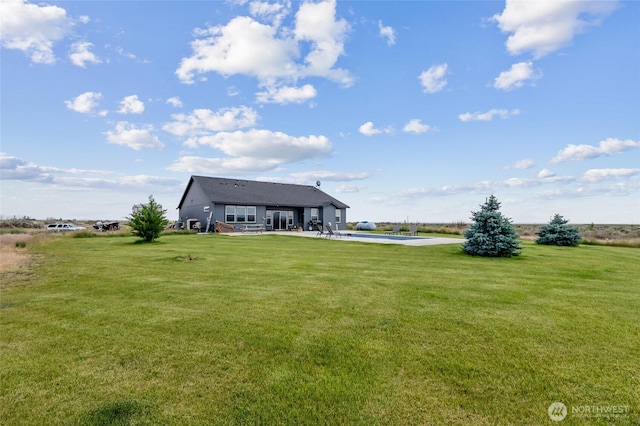 7186 16th Rd NE, Moses Lake, WA 98837 - view of grassy yard featuring a patio area