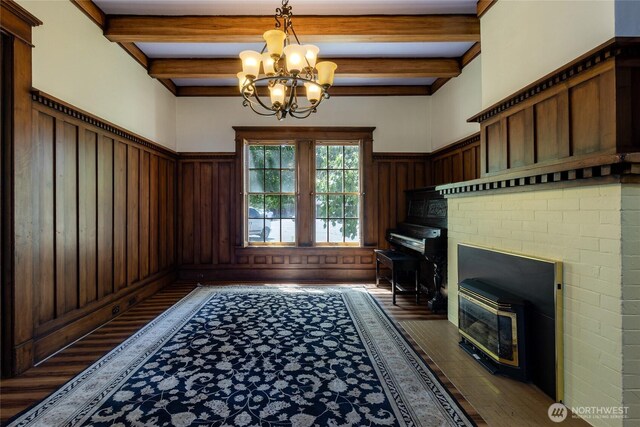 244 Marcus St, Walla Walla, WA 99362 - entryway with beamed ceiling, wood finished floors, a chandelier, and a wainscoted wall