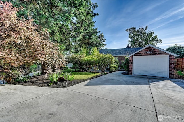10825 Marine View Dr SW, Seattle, WA 98146 - view of front of property featuring driveway, brick siding, and a chimney