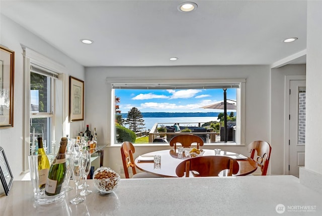 10825 Marine View Dr SW, Seattle, WA 98146 - dining room featuring recessed lighting, healthy amount of natural light, and a water view