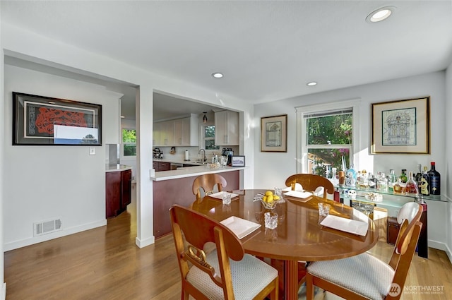 10825 Marine View Dr SW, Seattle, WA 98146 - dining area with wood finished floors, recessed lighting, and baseboards