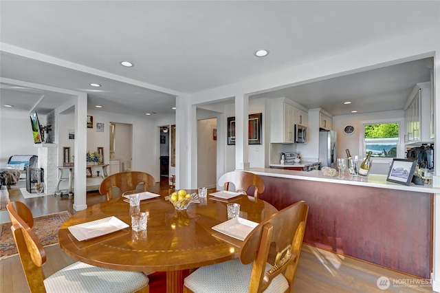 10825 Marine View Dr SW, Seattle, WA 98146 - dining area featuring wood finished floors and recessed lighting