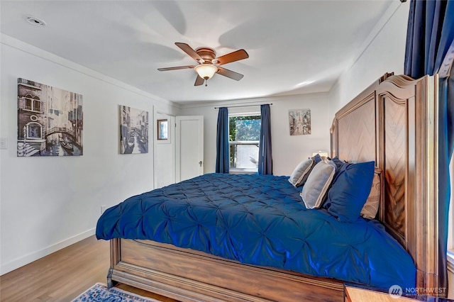 10825 Marine View Dr SW, Seattle, WA 98146 - bedroom featuring wood finished floors, baseboards, and a ceiling fan