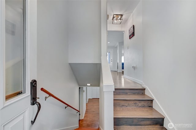 10825 Marine View Dr SW, Seattle, WA 98146 - stairway featuring wood finished floors and baseboards